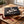 My Own Bundle Box on a table next to torn gift wrapping paper and a ribbon, AI-generated image