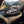 My Own Bundle Box on the dashboard of a car at a mountain pass viewpoint, AI-generated image