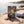 Renjer Elk Jerky Sea Salt on a smooth coastal rock by the sea, with a towel and sunglasses, AI-generated image