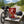 Renjer Red Deer Jerky Chili & Lime on a bench by a gravel road, with a bike and a cycling helmet, AI-generated image