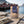 Sea Snacks Dried Atlantic Cod fillet strips on a wooden pier in a fishing village, with a fishing rod and a tackle box, AI-generated image