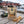 Sea Snacks Dried Sea Flounder fillet strips on a wooden pier in a fishing village, with a fishing rod and a tackle box, AI-generated image